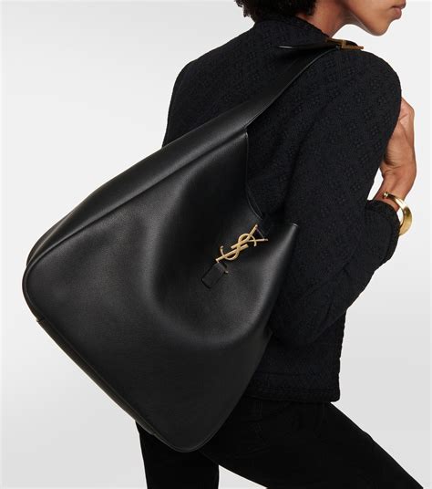 ysl tasche mytheresa|Large leather clutch in black .